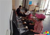 愛心企業助力創城 暖心盒飯送到一線